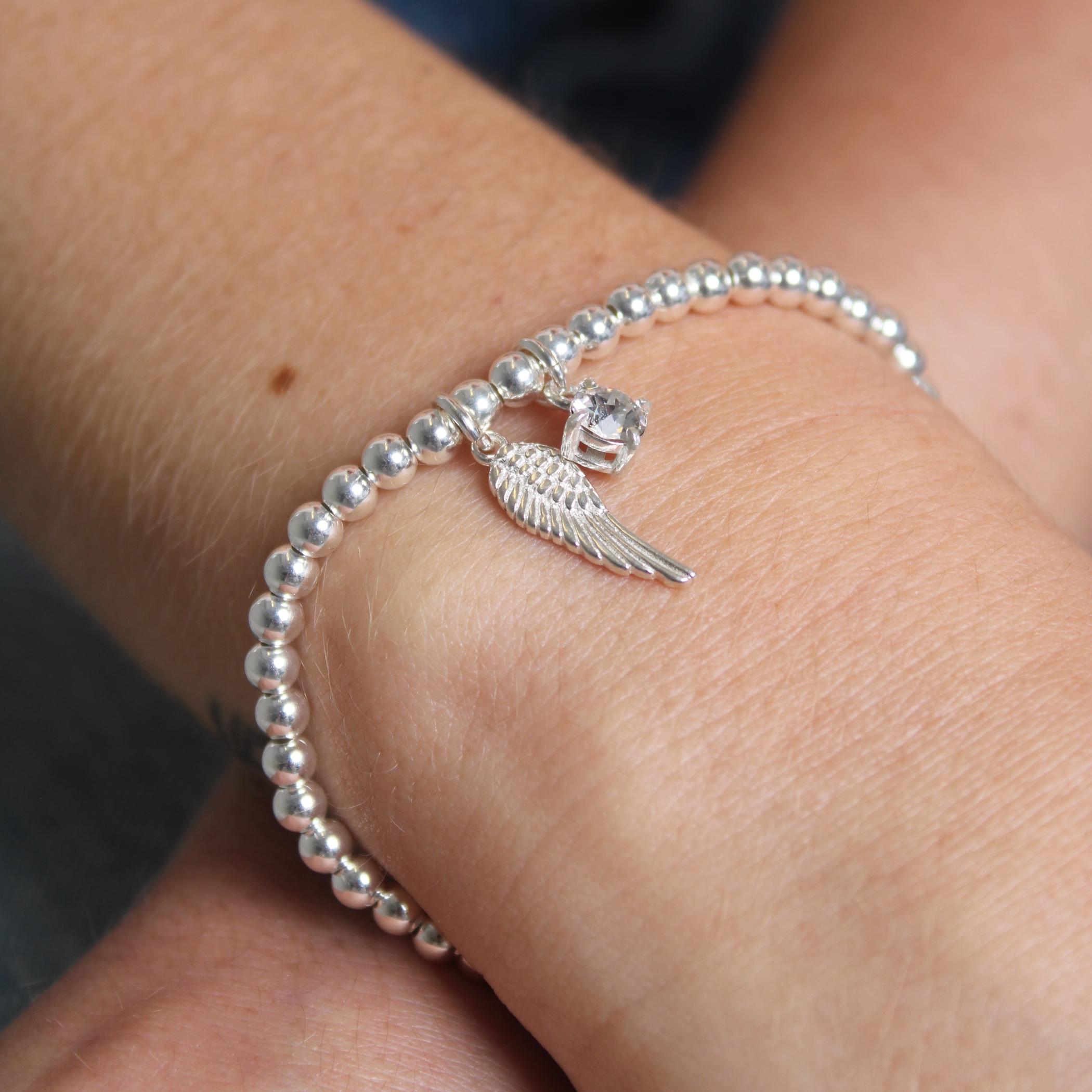 Tattoo bracelet with angel wing | Angel wing wrist tattoo, Tattoo bracelet, Charm  bracelet tattoo
